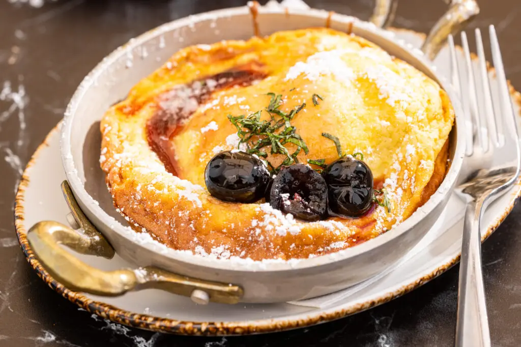The semolina Dutch baby with Luxardo cherries on the brunch menu at 61 Osteria. (Photo by Kathy Tran)