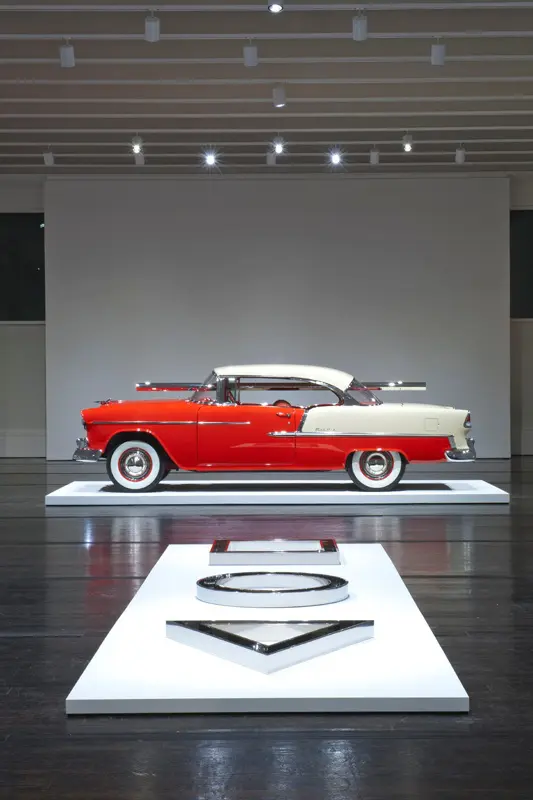 Walter De Maria's "Bel Air Trilogy, 2011 (Automobile)," stands alongside an earlier tripartite sculpture, "Channel Series: Triangle,
Circle, Square," 1972. This installation appeared in the "Walter De Maria: Trilogies" exhibition, which ran from September 2011 to January 2012 at The Menil Collection. (Courtesy The Menil Collection. Photo by Paul Hester.)