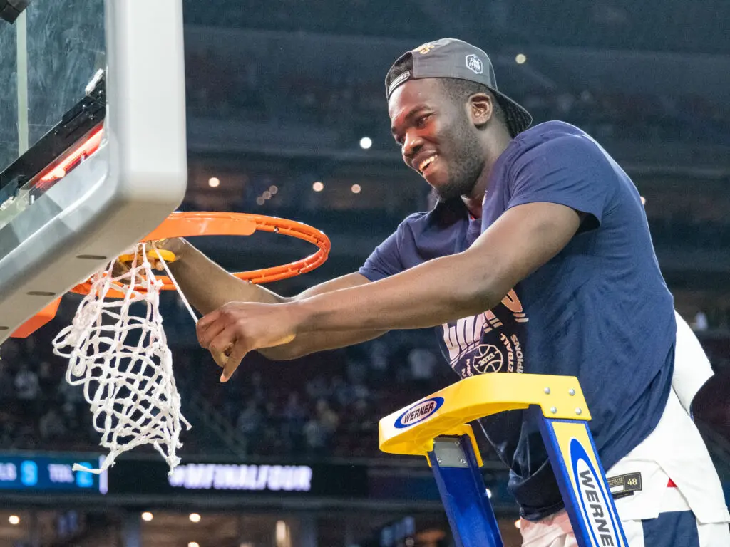 Adama Sanogo got to cut down the nets and won Final Four Most Outstanding Player for UConn. (Photo by F. Carter Smith)