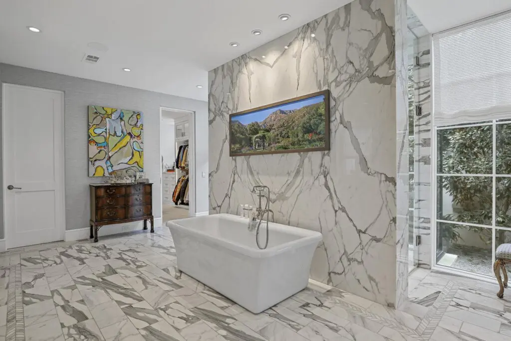 Luxury meets elegance in the marble bathroom.