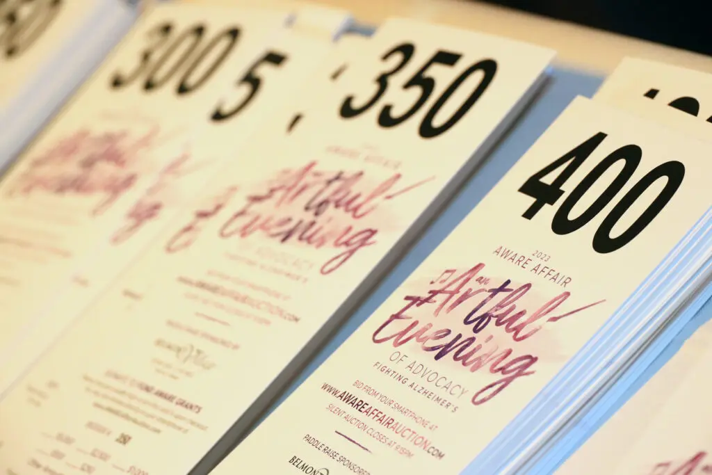 Bidder cards with logo (Photo by Lisa Stewart and Rob Wythe/Wythe Portrait Studio)