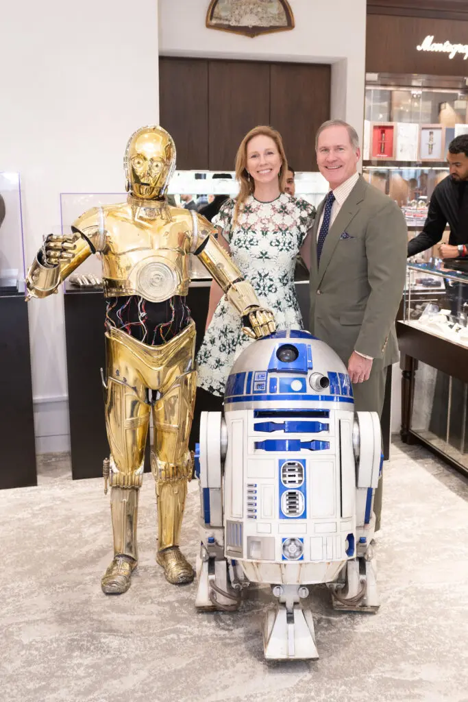 C-3PO, R2-D2, Kimberly and James Bell make the scene at the Valobra Star Wars exhibit. (Photo by Wilson Parish)