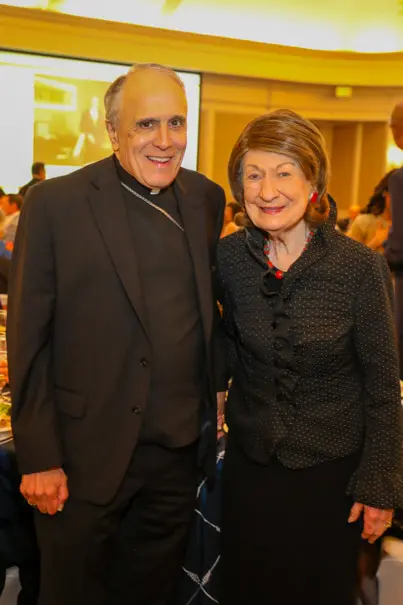 Cardinal Daniel DiNardo, Cora Sue Mach at the Men of Distinction awards luncheon. (Photo by Priscilla Dickson)