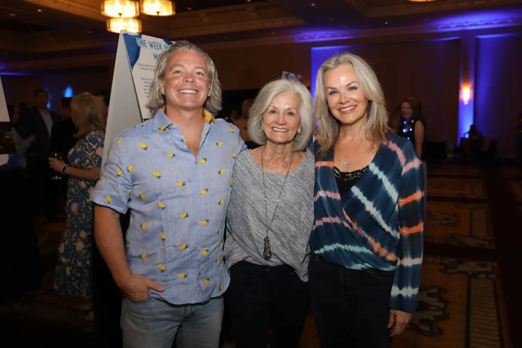 David Roe, Charlene Storms, Collyne Roe at the Child Advocates benefit dinner.  (Photo by Priscilla Dickson)