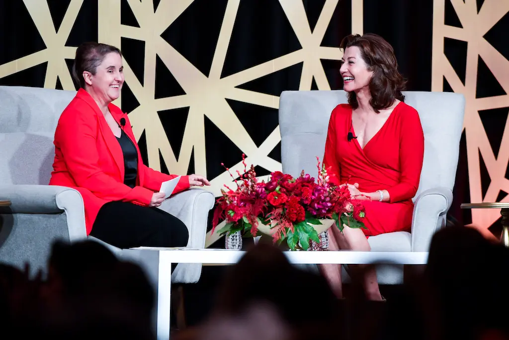 Emcee Sarah Pepper interviews Amy Grant at the American Heart Association Go Red for Women Luncheon 