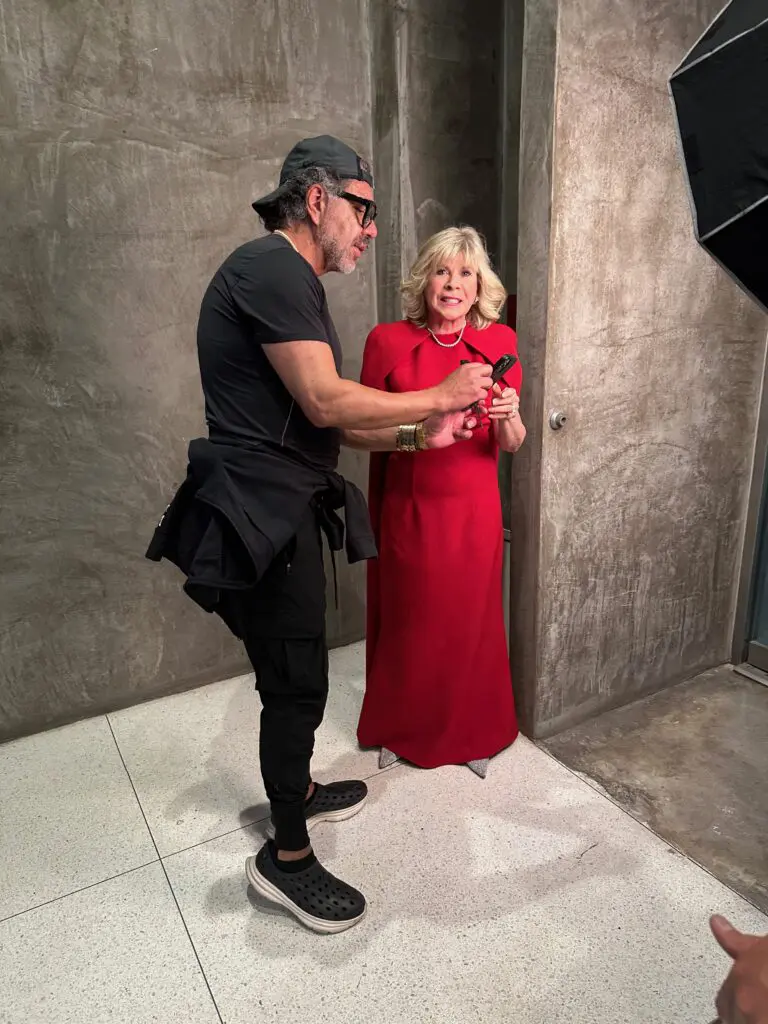 Hair stylist Ceron works with Best Dressed honoree Zane Carruth at the PaperCity photo shoot.