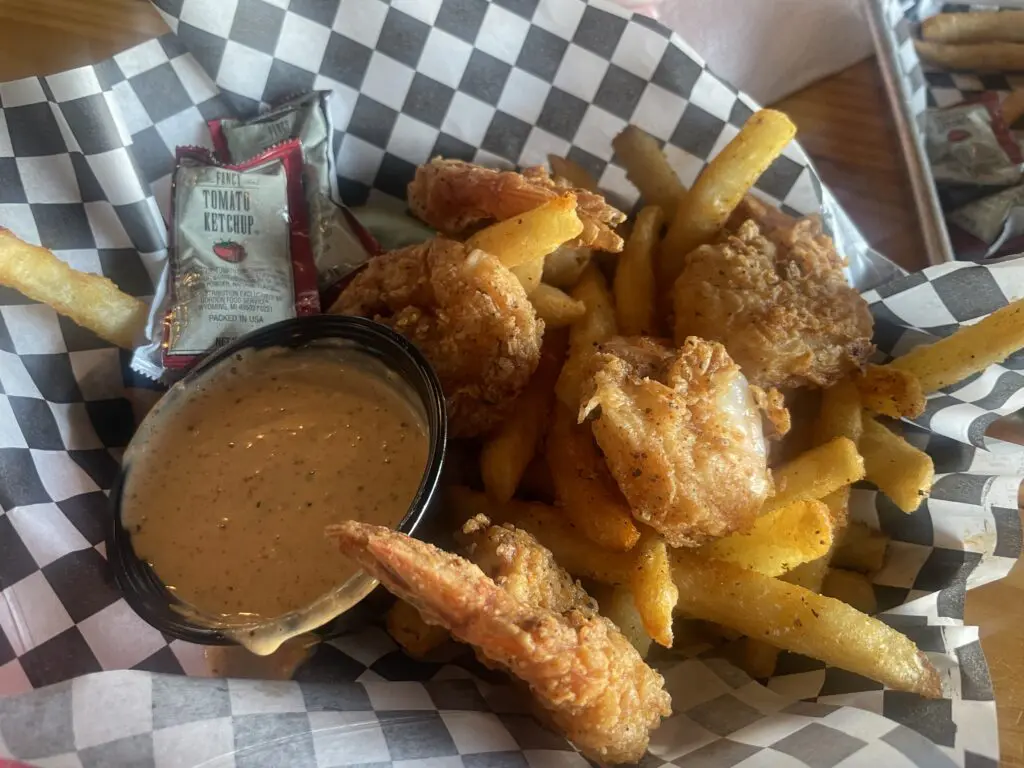 The fried shrimp basket is served with remoulade and spiced fries.