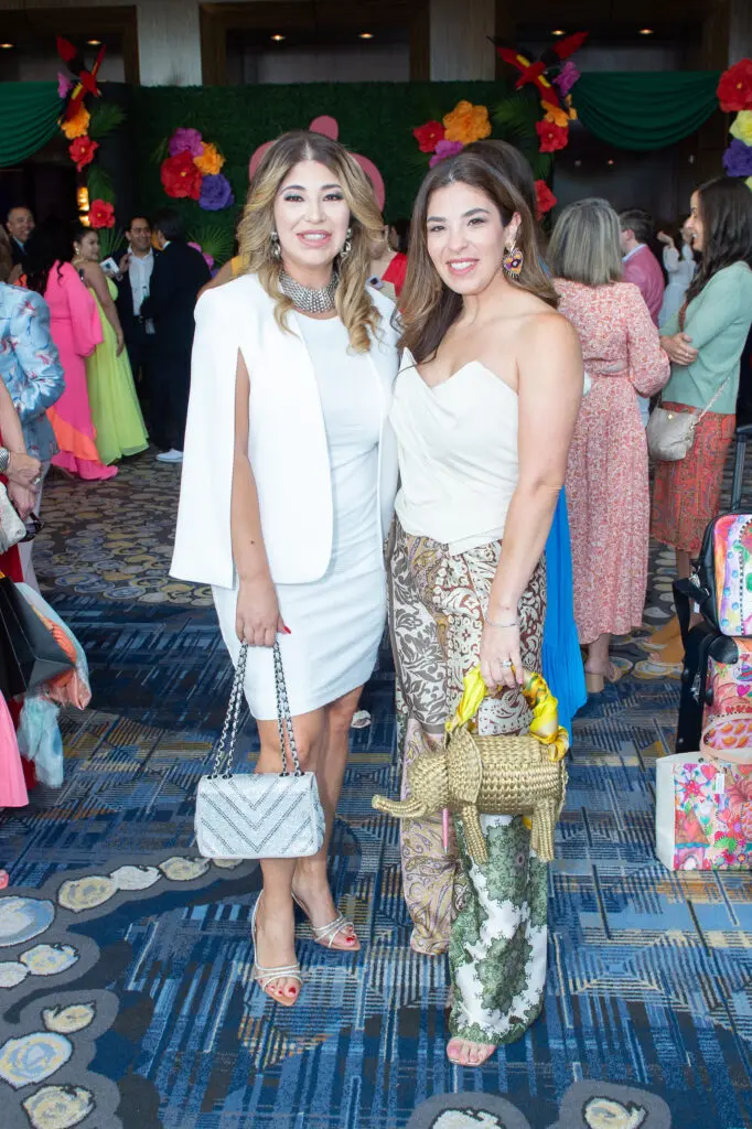 Jennifer Ortiz, Arlene Escamilla at the Latin Women's Initiative fashion show and luncheon. (Photo by Jacob Power)