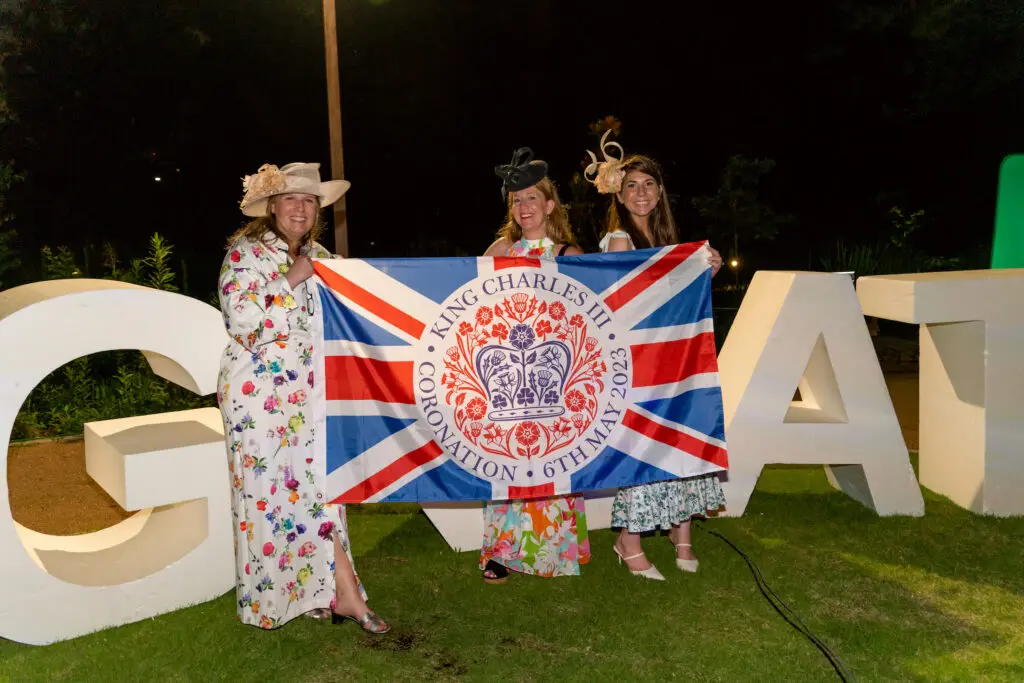 Guests of the British Consulate attend the invitation-only party celebrating King Charles' coronation. (Photo by  Joffre Camacho, Square Foot Photography)