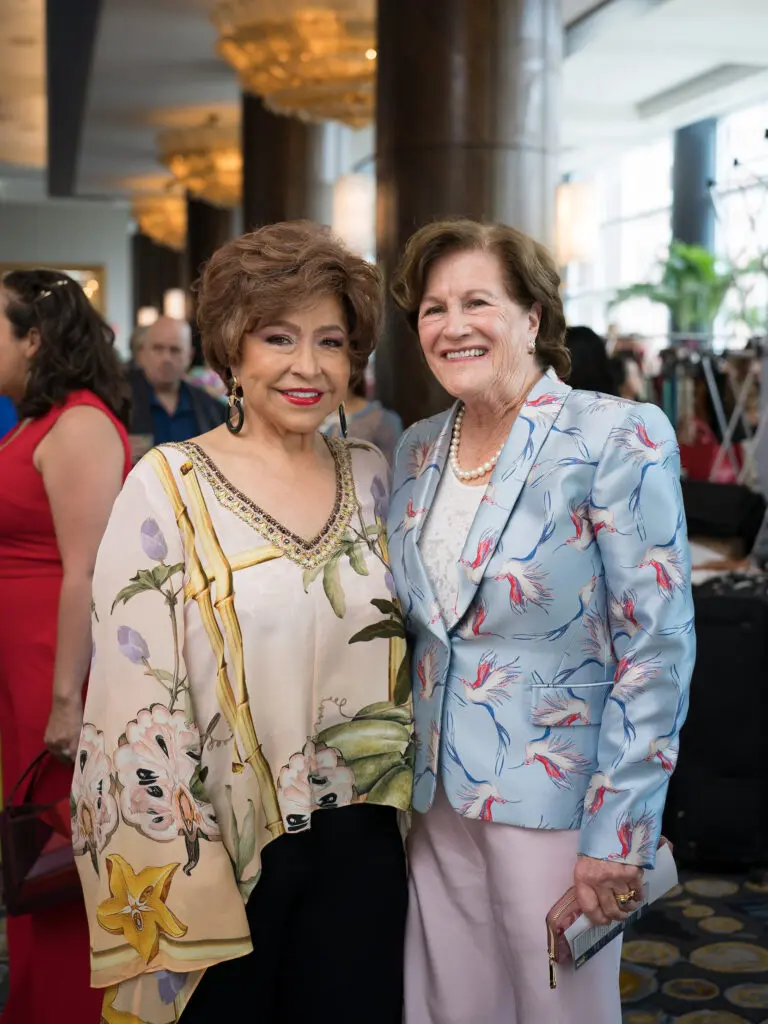 Trini Mendenhall, Nancy Levicki at the Latin Women's Initiative fashion show and luncheon. (Photo by Daniel Ortiz)