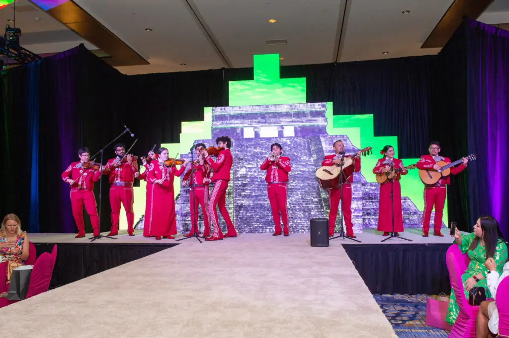 University of Houston Moores School of Music Mariachi Pumas welcome guests to the Hilton Americas-Houston ballroom for the Latin Women's Initiative fashion show and luncheon. (Photo by Jacob Power)