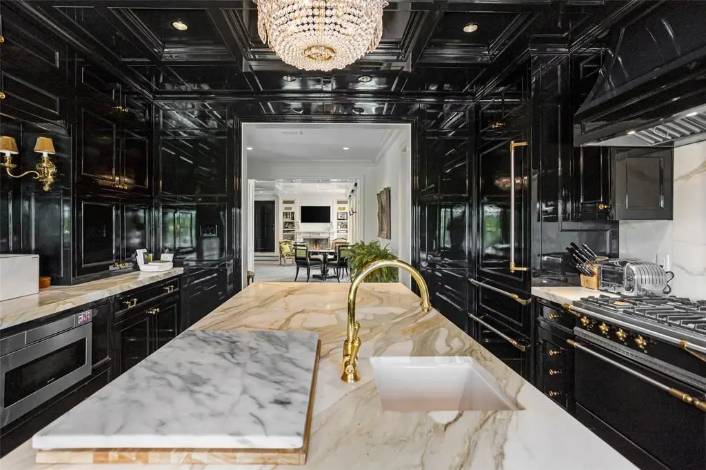 A moody black lacquer pops in the kitchen at 5700 Westover Court.