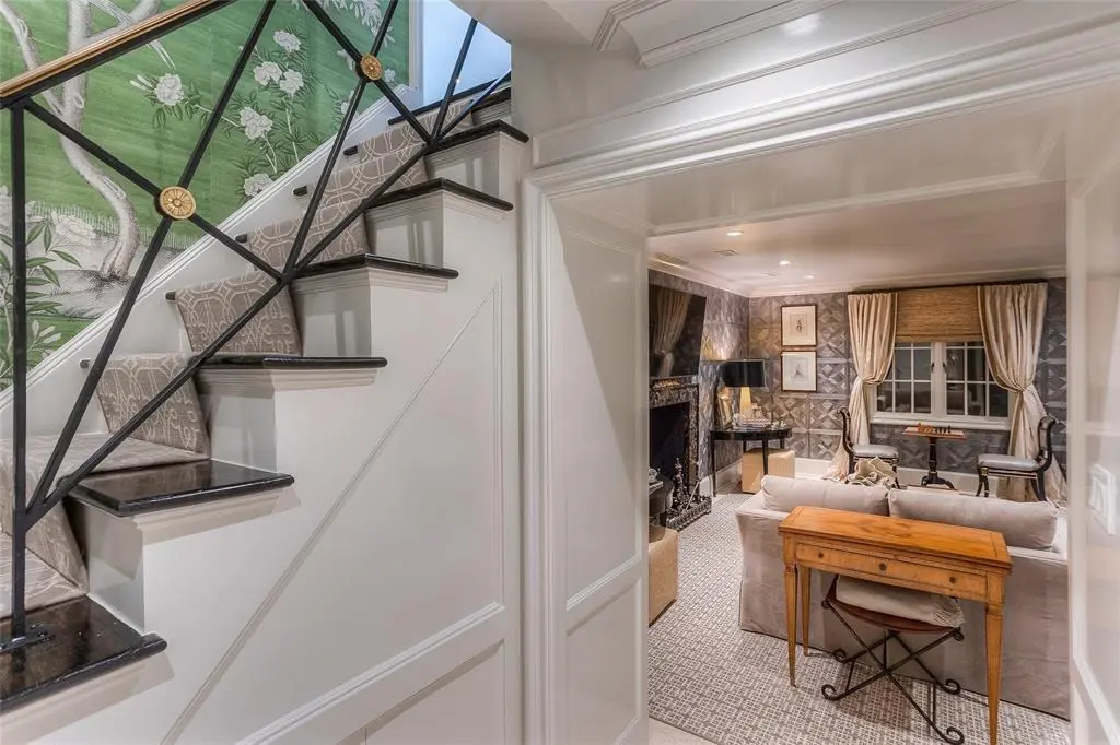 The basement is another entertaining space covered in Phillip Jefferies wallpaper.