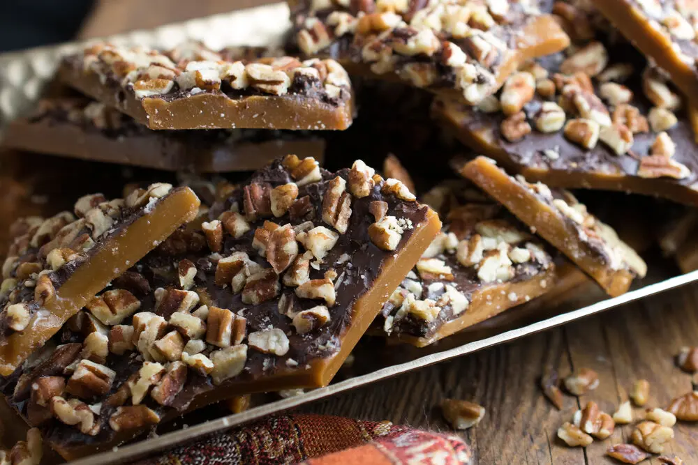 Simply delicious Wildtoad Toffee brings a coating of dark chocolate and chopped pecans for the win.