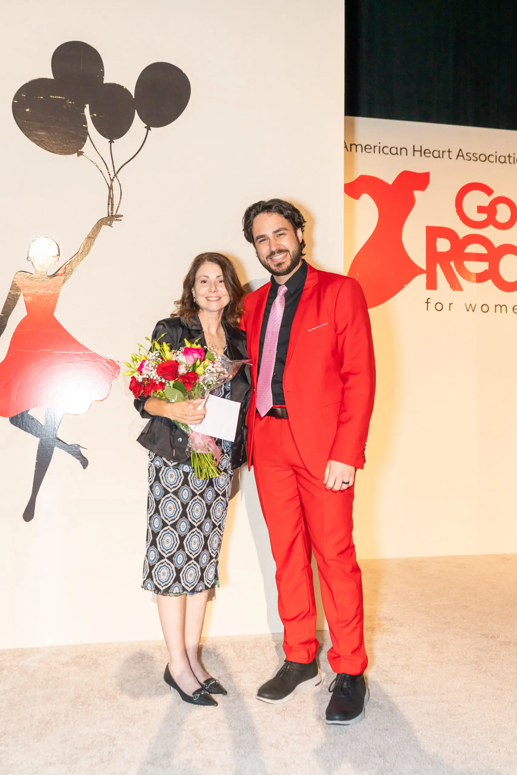 Donna Kammer with the emcee David Deveau at the Go Red Luncheon in The Woodlands.