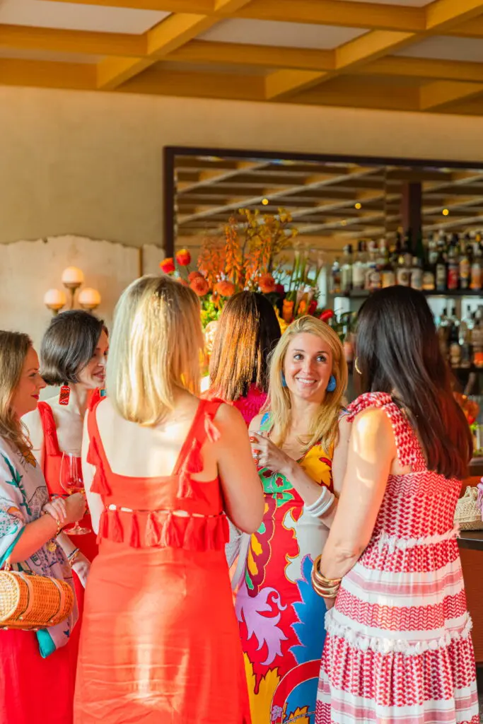 Natalie Steen mingles with guests donning Red Clay red. (Photo by Zachary Horst)