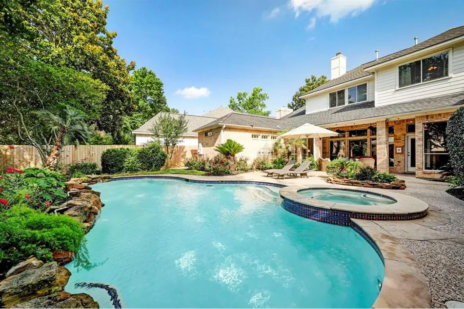 19 Flagsone Path is one showcase home in The Woodlands that knows how to showcase a pool.