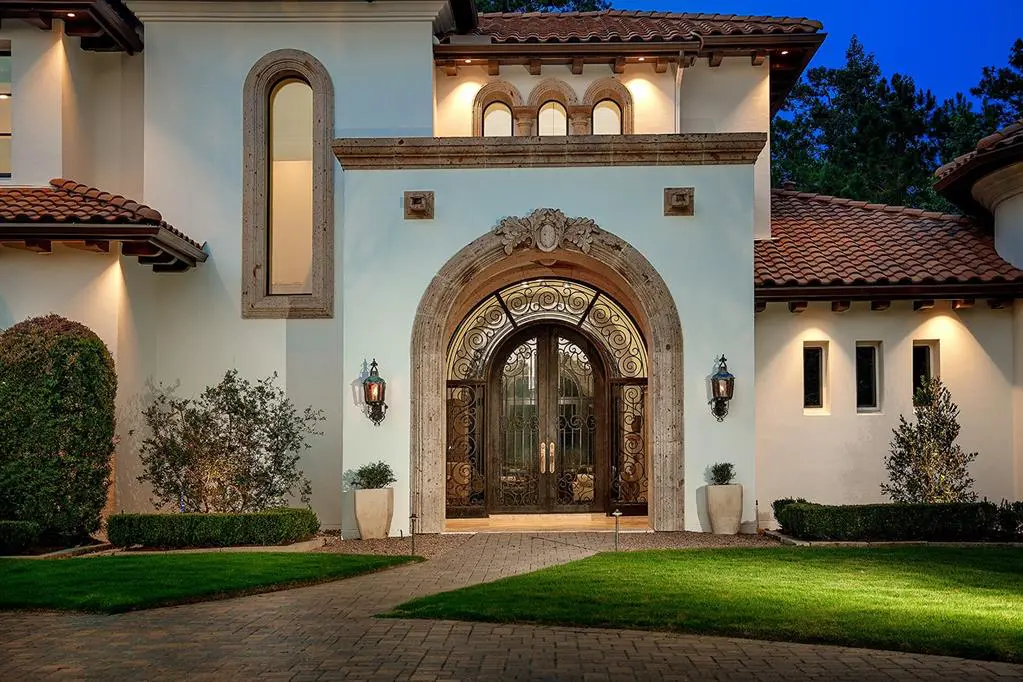 The grand entrance to 2 Electra Circle shows this is a mansion in The Woodlands that knows how to make a statement.