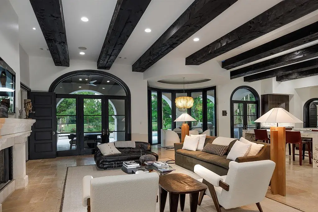 The open concept living space enjoys views of the amazing backyard. 