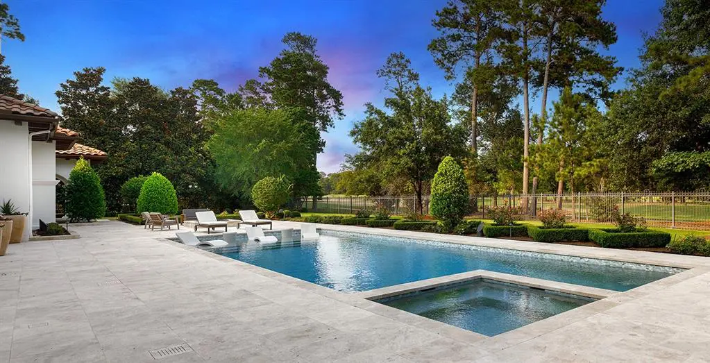 The swimming pool looks over the fairways of the Jack Nicklaus course at Carlton Woods.
