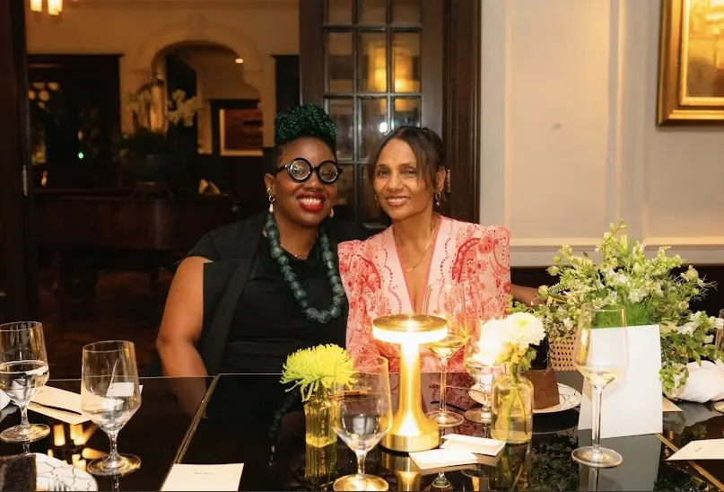 Pictured from Left: Gallerist Janice Bond, owner of Art Is Bond gallery and artist Ming Smith attend a dinner held in Smith's honor at La Colombe D'Or to celebrate her solo retrospective "Feeling the Future" exhibit at the Contemporary Arts Museum Houston. (Photo by Troy Montes. Courtesy Art Is Bond)