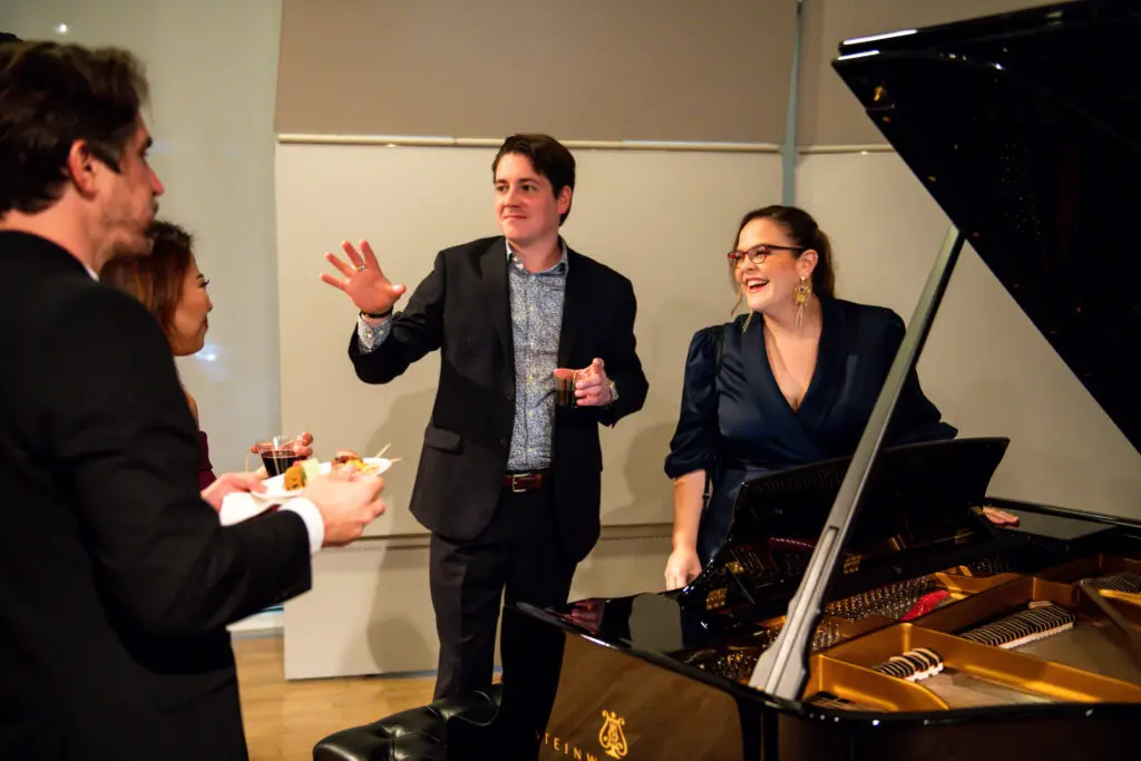 Piano specialist with Steinway Piano Gallery Amanda Watson visits with guests following the physician's concert at MATCH. (Photo by Matthew Rood)