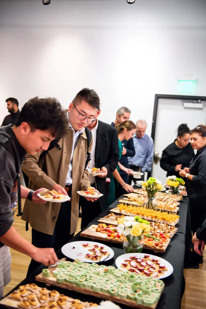 Guests enjoying Chef Soren Pedersen party fare  at the Steinway physicians concert at MATCH. (Photo by Matthew Rood) (Photo by Matthew Rood)