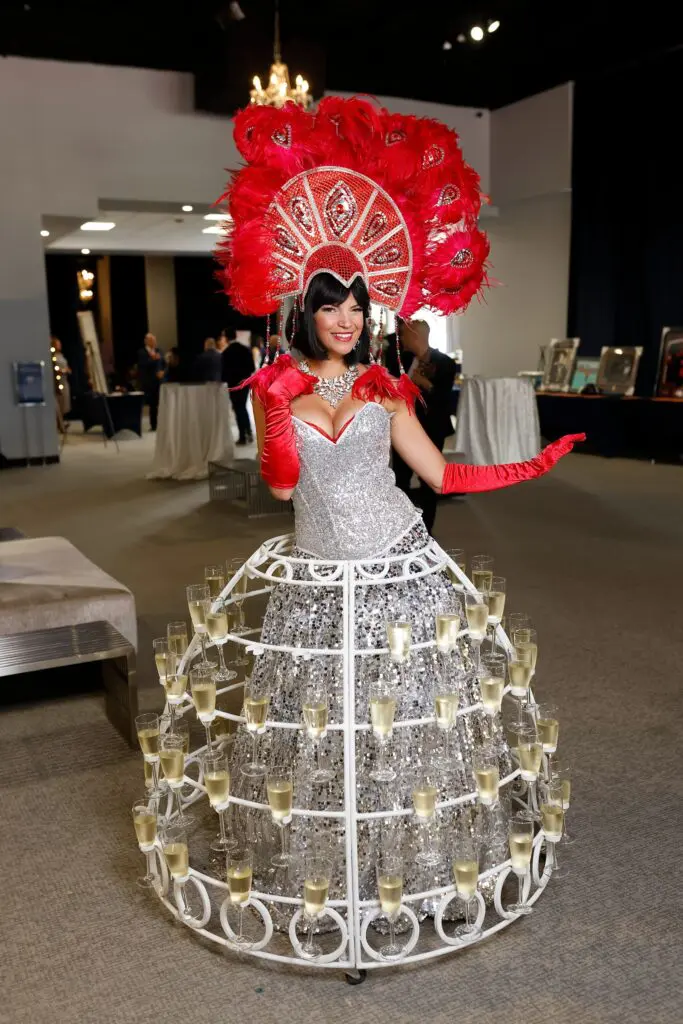 Champagne lady at The Big Brunch benefiting Children at Risk (Photo by Quy Tran)