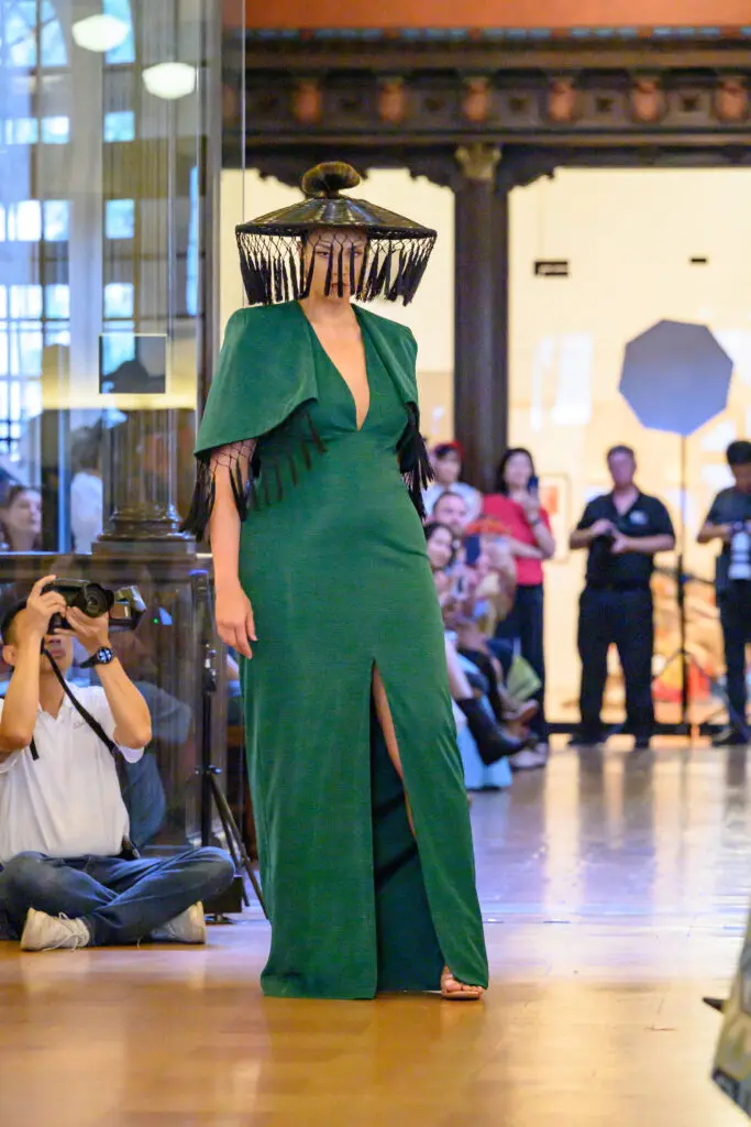 A dark green dress by Chloe Dao at Ascend AAPI Spring Fashion Show (Photo by Ken Jones)