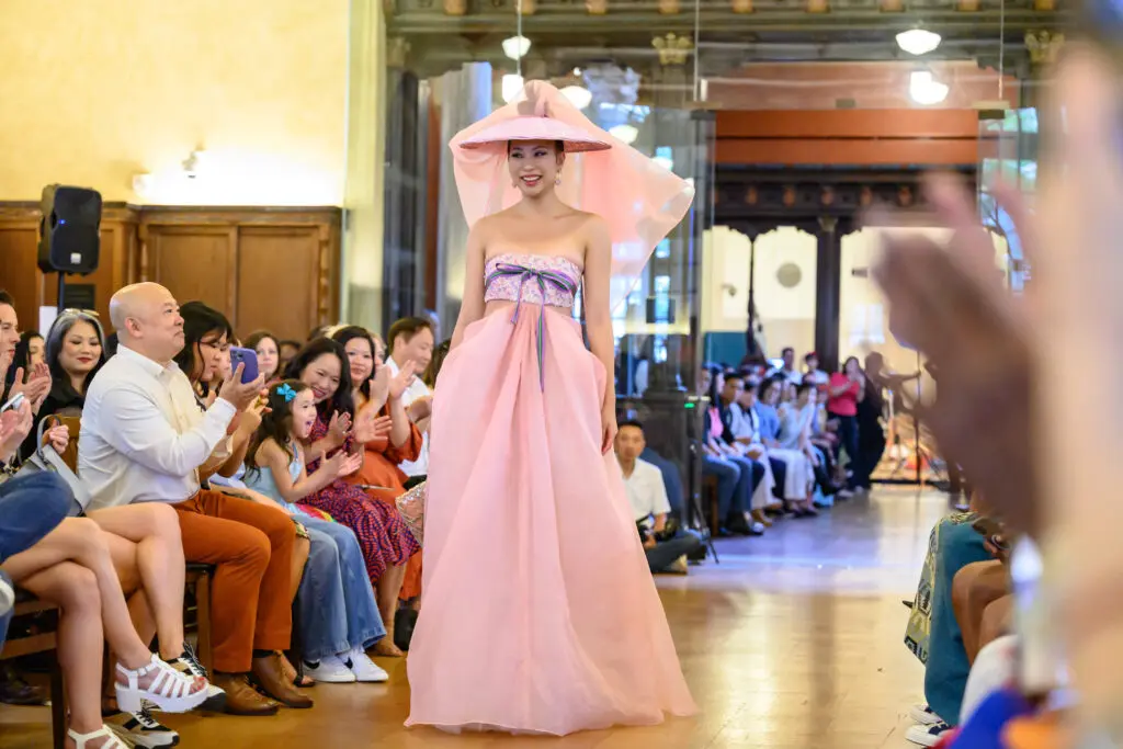 Chloe Dao's pink dress modeled by Karen Yang at Ascend AAPI Spring Fashion Show (Photo by Ken Jones)