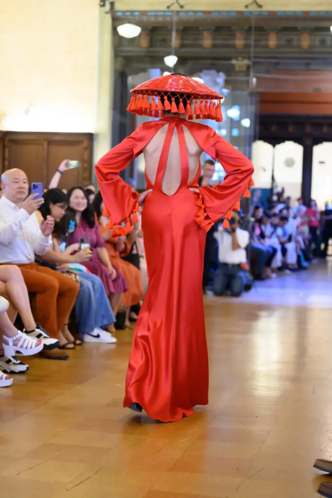 Chloe Dao's red dress modeled by Duyen Nguyen at the Ascend AAPI Spring Fashion Show (Photo by Ken Jones)