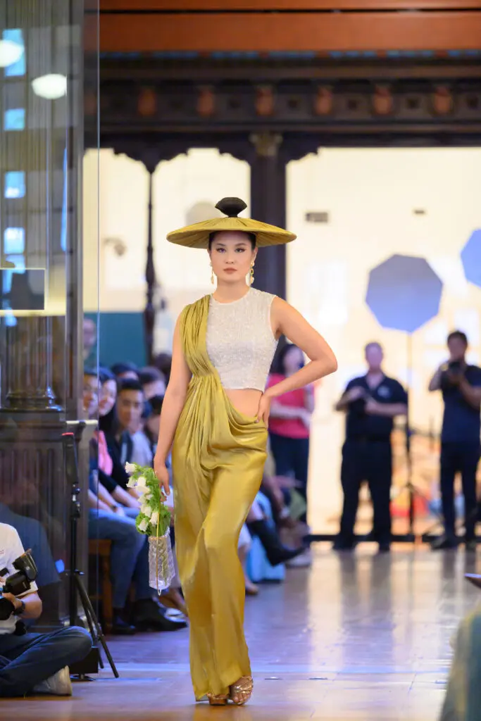 Chloe Dao's chartreuse dress modeled by Heidi Shay at the Ascend AAPI Spring Fashion Show (Photo by Ken Jones)