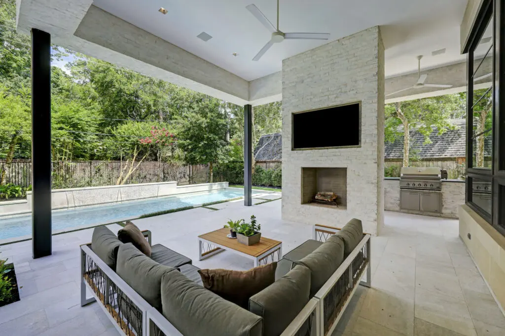 Fireplace, summer kitchen and pool at 410 Coachman in Bunker Hill (Photo by TK Images)