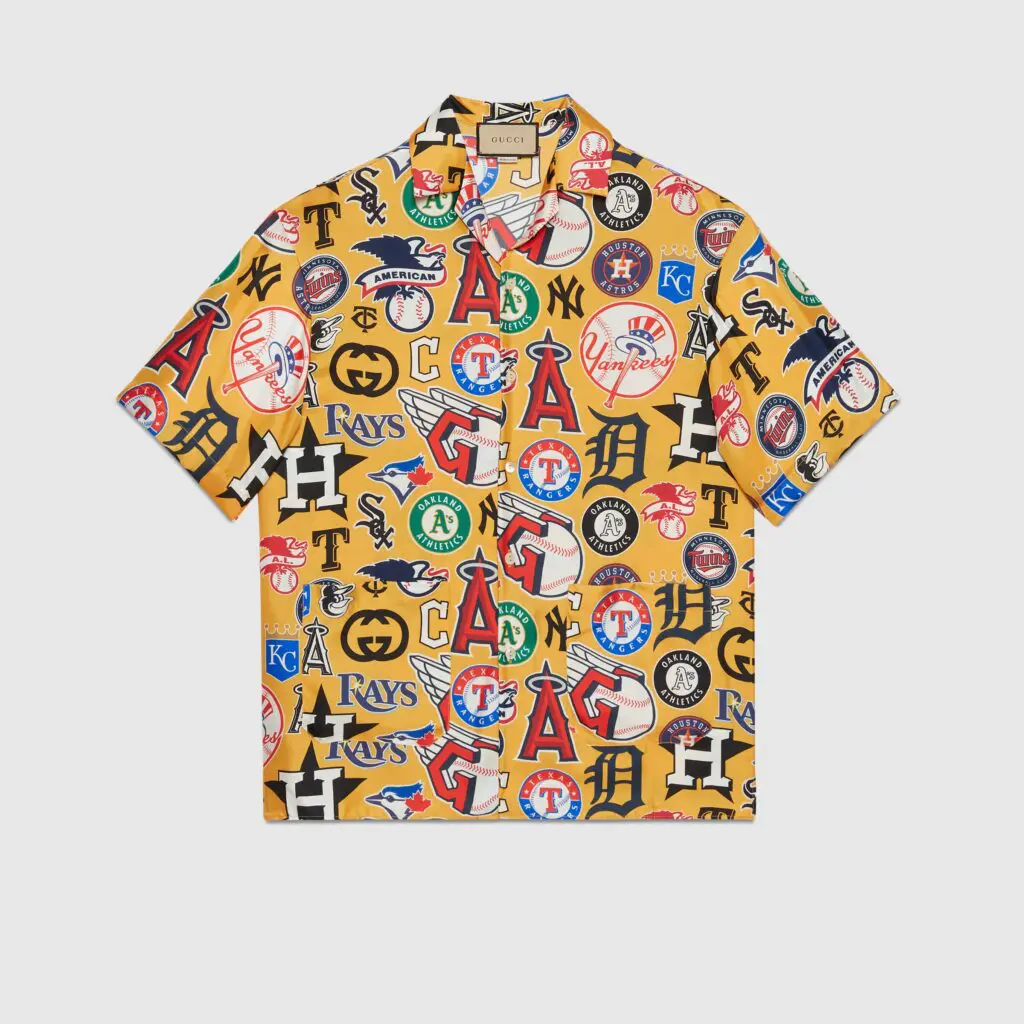 Gucci embraces baseball fever with casual wear celebrating top MLB teams. Look close and you can see the Astros MLB logo on the Gucci bowling shirt.
