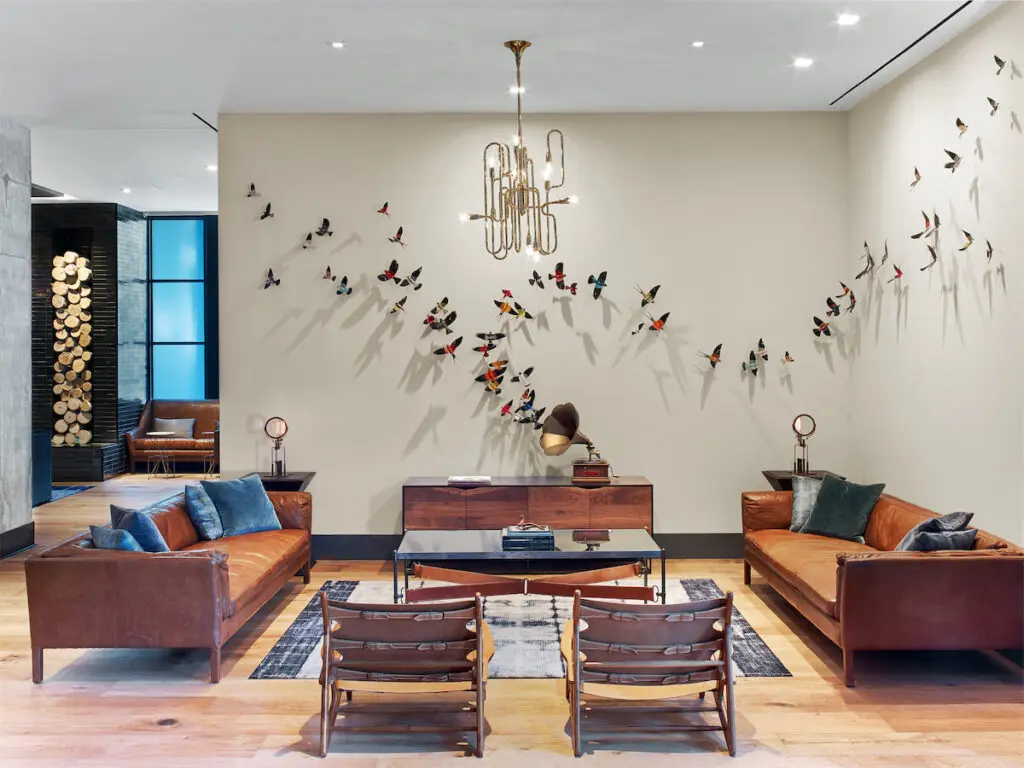 Hotel Van Zandt's design boasts chandeliers made from French horns, flying bird art made of vinyl, framed replicas of vintage posters, and more nods to its musical theme.