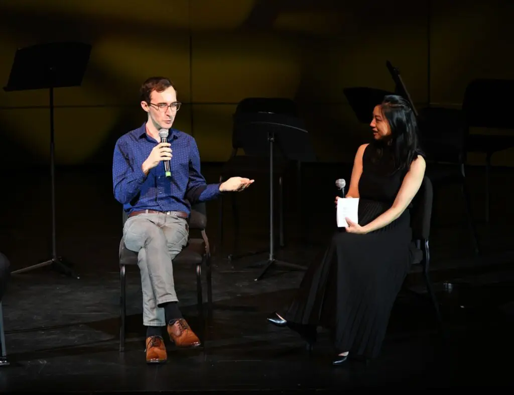 Composer Theo Chandler, in conversation with Kinetic artistic director Natalie Lin Douglas, introduces "Beyond the Sanctuary Walls" to the audience in its May 26t world premiere at Houston's MATCH Theater. (Photo by Jeff Grass. Courtesy Kinetic Ensemble)