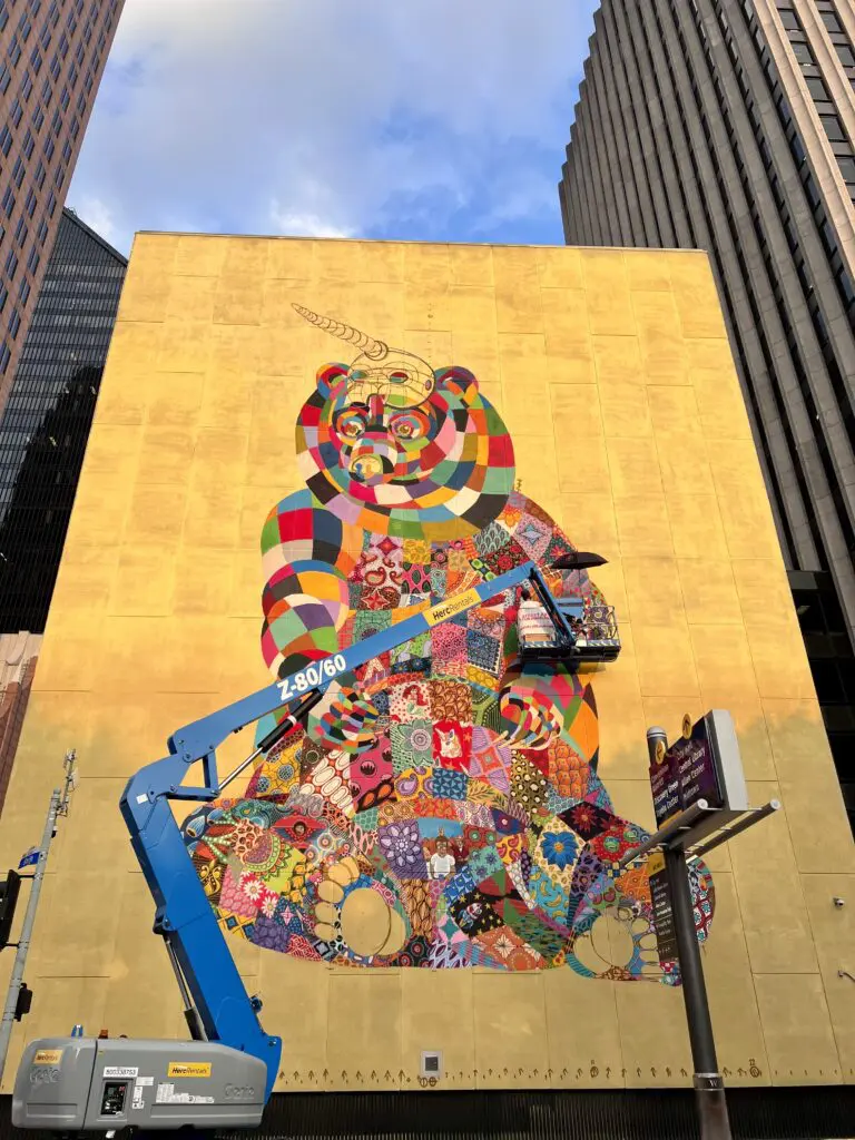 "We All Wear the Mask, But How Long Will It Last" by Louis Masai in progress  (Photo by Street Art for Mankind)