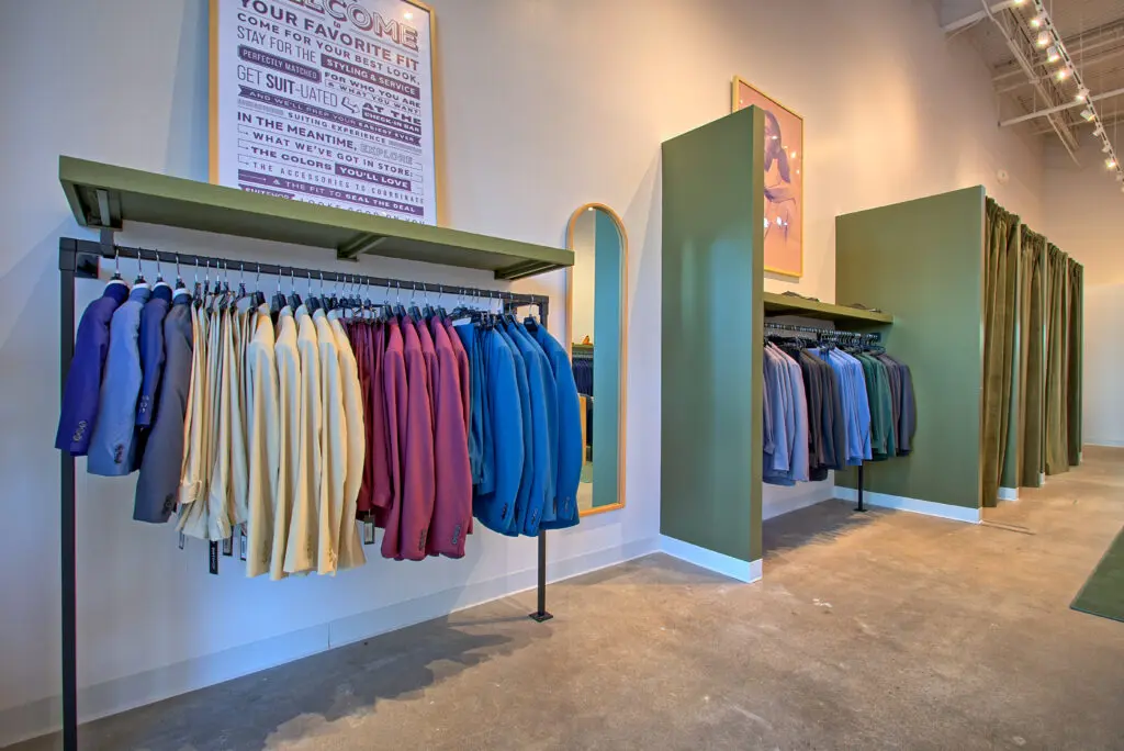 Suit jackets and pants on display at SuitShop's new M-K-T store (Photo by Adam Hart)