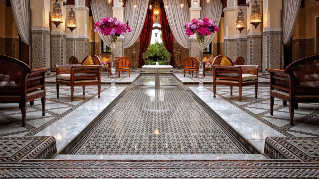 The central courtyard where a fountain trickles, caged birds warble and lavish florals welcome new arrivals at the Royal Mansour in Marrakech, Morocco.