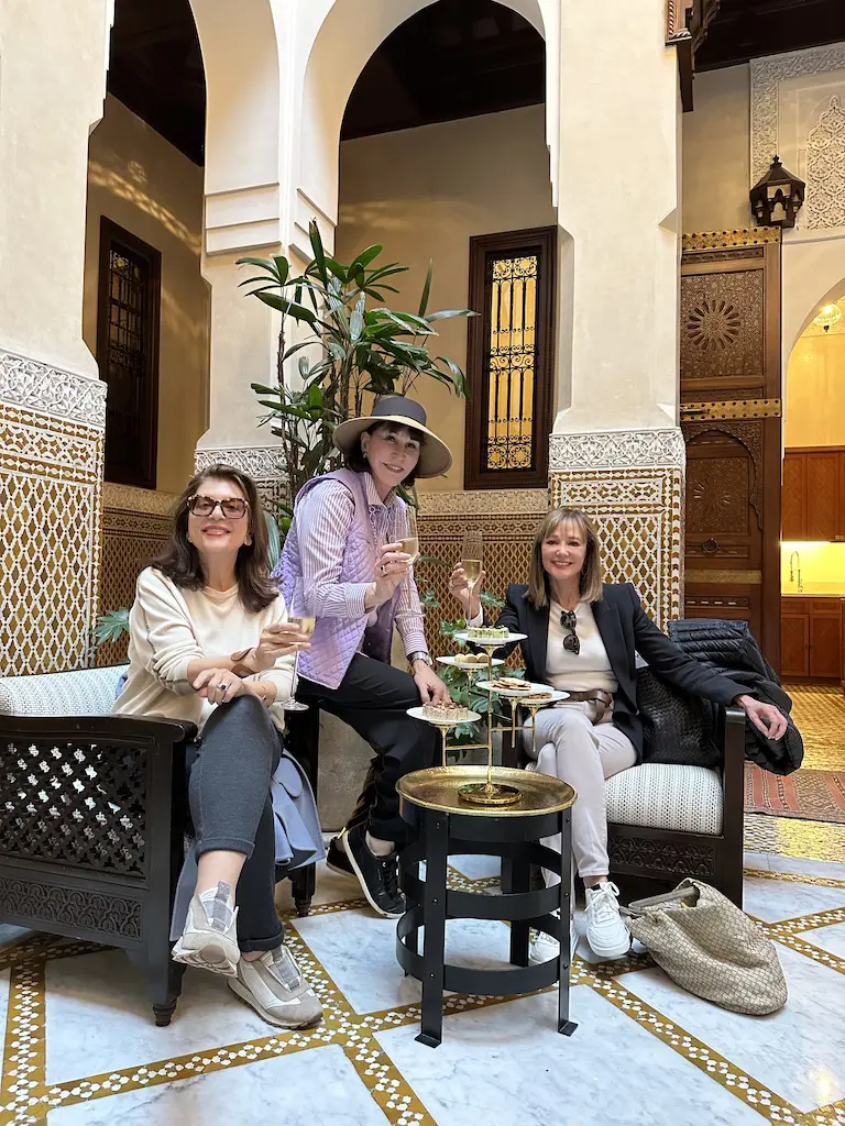 After arriving from Ireland suite mates —  Dancie Ware, Shelby Hodge, Janet Gurwitch — enjoying the welcome champagne in our riad at the  Royal Mansour in Marrakech, Morocco