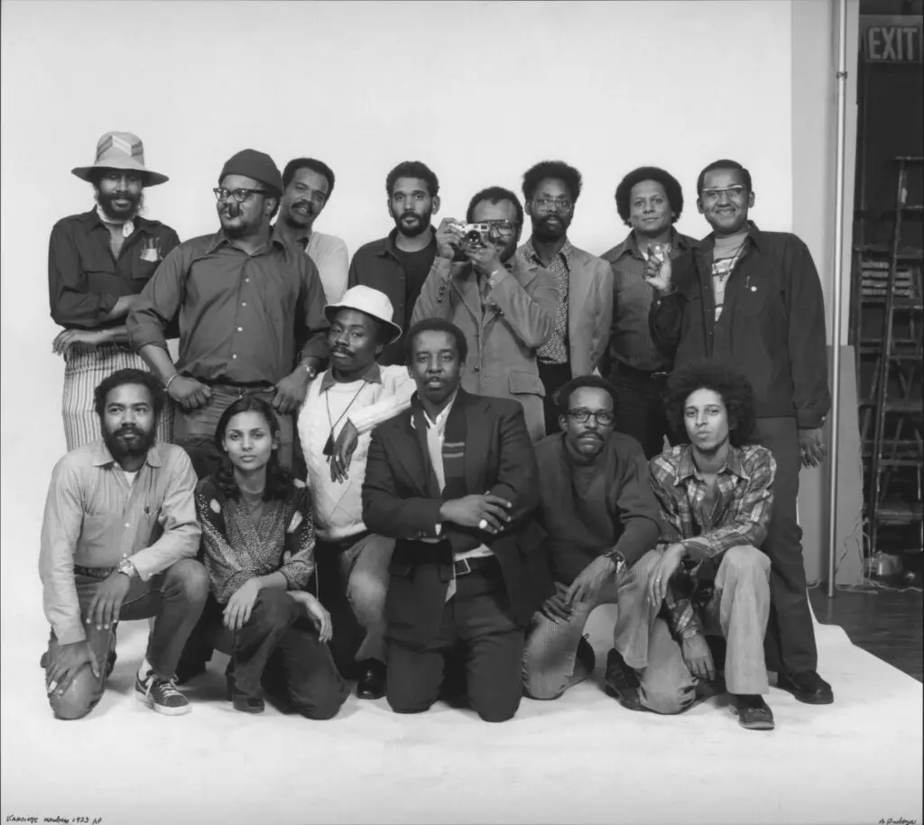 The Kamoinge Workshop photographers, led by photographer Roy DeCarava, are pictured here in 1973. Front row, second left: Photographer Ming Smith. (Photo by Anthony Barboza. Courtesy Getty Center)