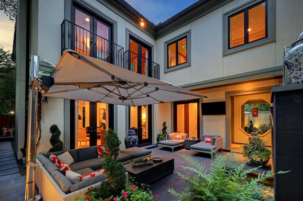 The primary outdoor entertaining space in the luxurious 'Tuscan Villa' townhome at 5722 Logan Lane (Photo by TK Images/Compass)
