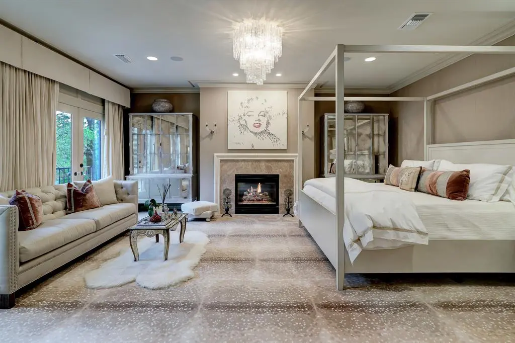 The primary bedroom in the luxurious 'Tuscan Villa' townhome at 5722 Logan Lane (Photo by TK Images/Compass)