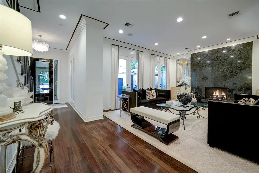 The open floor plan in the luxurious 'Tuscan Villa' townhome at 5722 Logan Lane invites lavish entertaining. (Photo by TK Images/Compass)