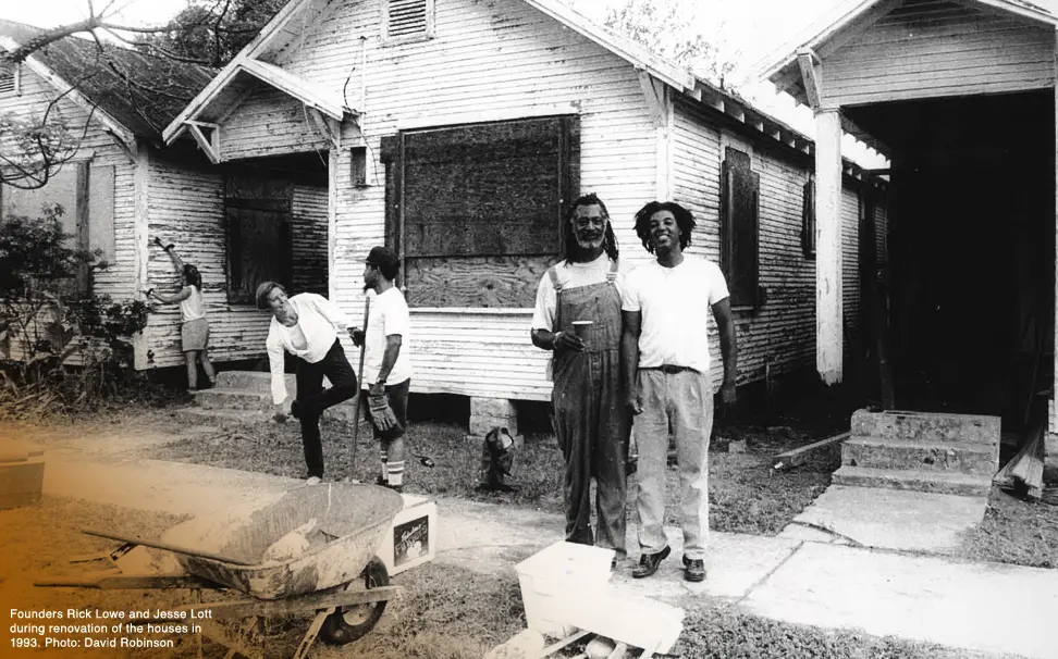 Project Row Houses co-founders Jesse Lott and Rick Lowe in front of the row houses which eventually became Project Row Houses in 1993. Project Row Houses, now led by executive director Eureka Gilkey, is celebrating its 30th Anniversary this year. (Photo by David Robinson, courtesy Project Row Houses, Houston)