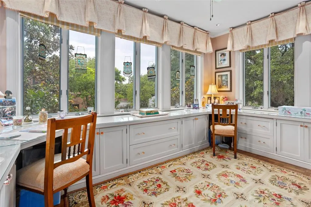 2424 Medford Court - the study lined with counter surfaces and windows.