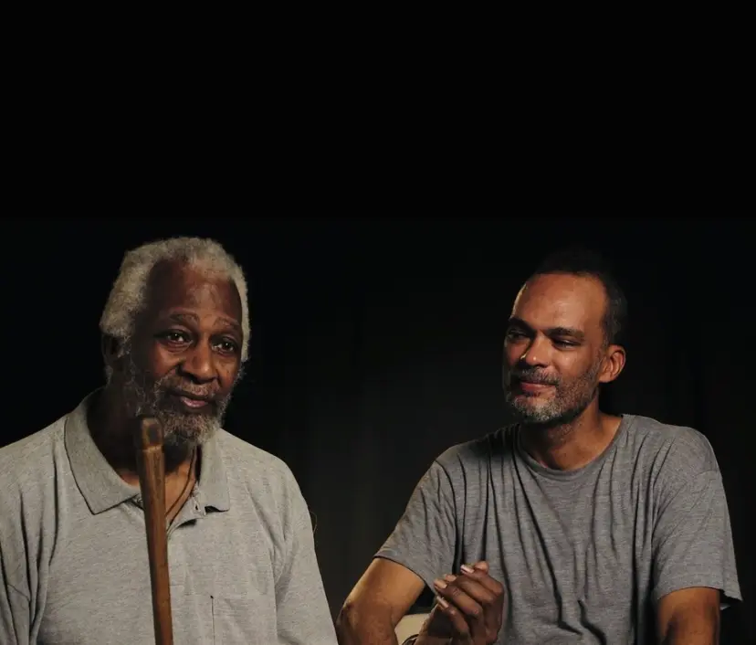 Jesse Lott and his son Vida Lott appeared in the documentary "Jesse Lott: Art & Activism," directed by filmmaker and 14 Pews founder Cressandra Thibodeaux. The documentary was shot by Thibodeaux and students from her film workshop. (Courtesy Cressandra Thibodeaux)