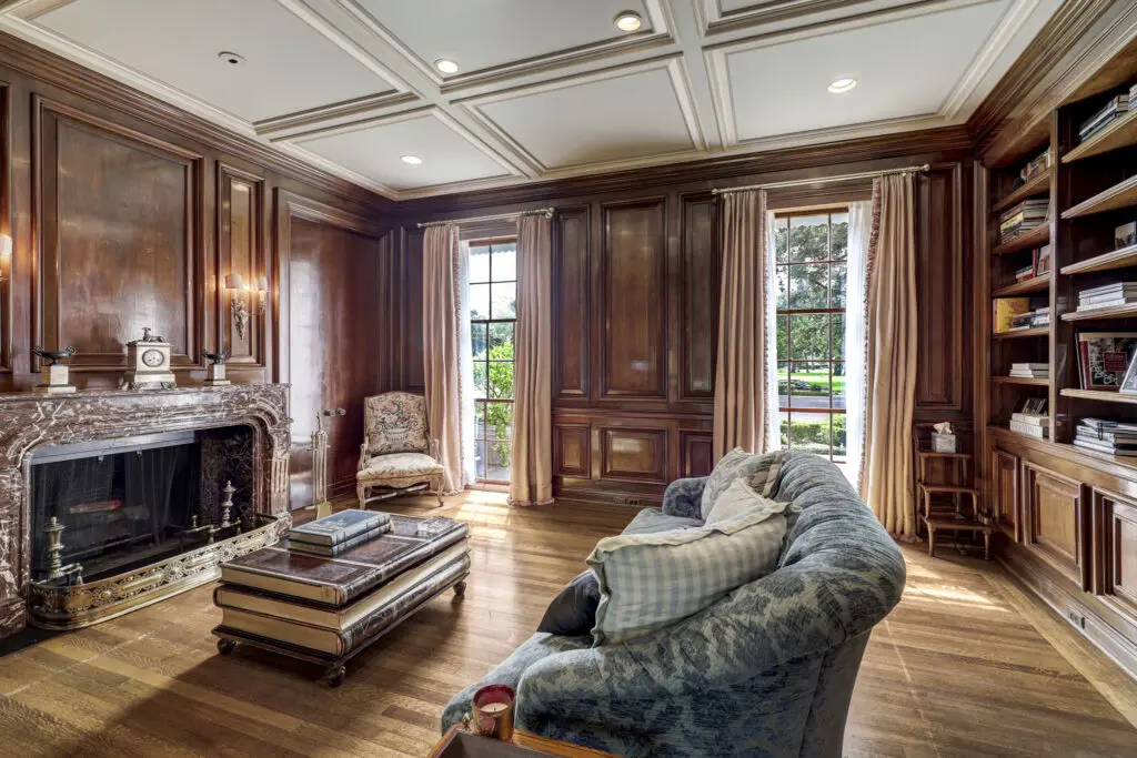 The beautifully paneled library in the Birdsall Briscoe home at 3425 Sleepy Hollow Court. (Photo by TK Images/Courtesy of Compass)