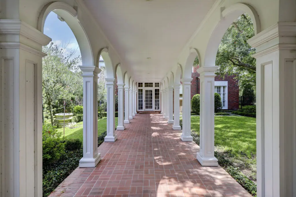 The colonnade that connects the house to the three-car garage in the Birdsall Briscoe home at 3425 Sleepy Hollow Court in River Oaks. (Photo by TK Images/Courtesy of Compass)
