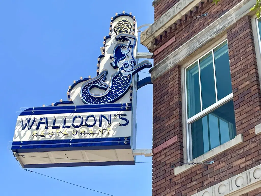 Walloon's - Signage installed on the historic 1927 building's façade. (Photo by Courtney Dabney)